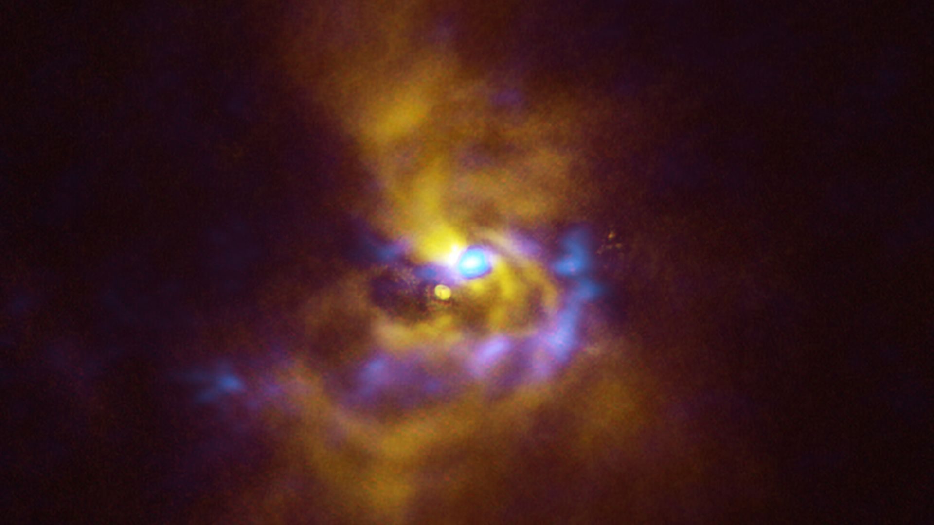 Combined SPHERE and ALMA image of material orbiting V960 Mon